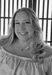 Smiling woman with long, blonde hair.